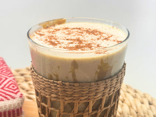 Creamy smoothie with cinnamon in a glass