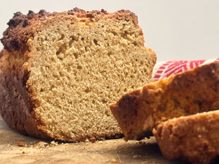 Close up of homemade banana bread on a cutting board.