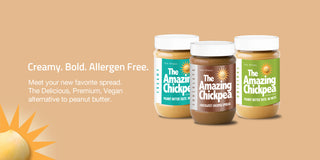Three jars of 'The Amazing Chickpea' chickpea butter on a beige background with promotional text 'Creamy. Bold. Allergen Free. Meet your new favorite spread. The Delicious, Premium, Vegan alternative to peanut butter.'